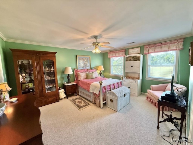 bedroom featuring crown molding, light carpet, visible vents, and multiple windows