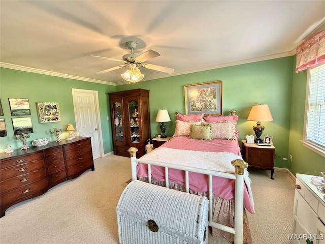 bedroom with light colored carpet, ornamental molding, baseboards, and a ceiling fan