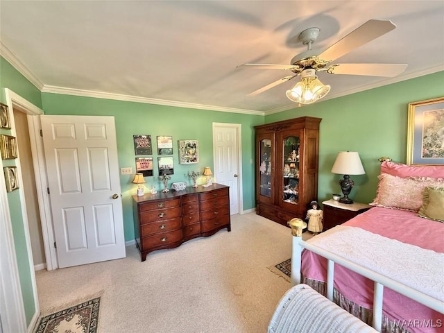 bedroom with ceiling fan, ornamental molding, and light carpet