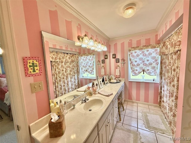 bathroom with tile patterned flooring, baseboards, vanity, ornamental molding, and wallpapered walls