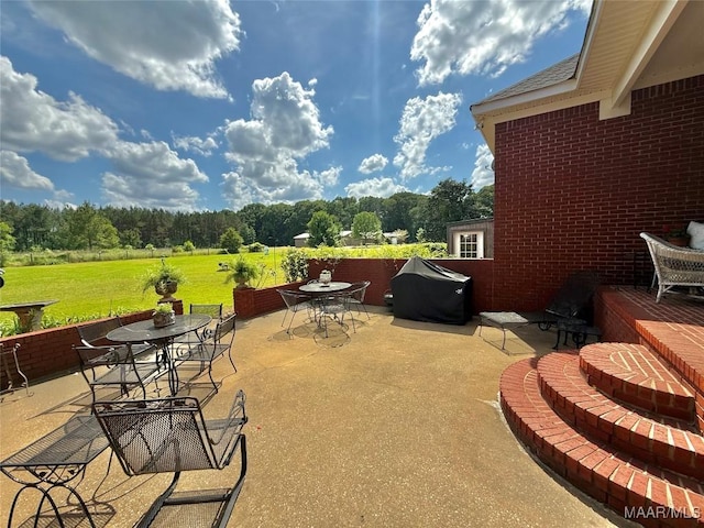 view of patio / terrace featuring outdoor dining area and area for grilling