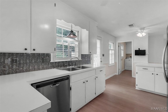 kitchen with visible vents, ceiling fan, white cabinets, a sink, and appliances with stainless steel finishes