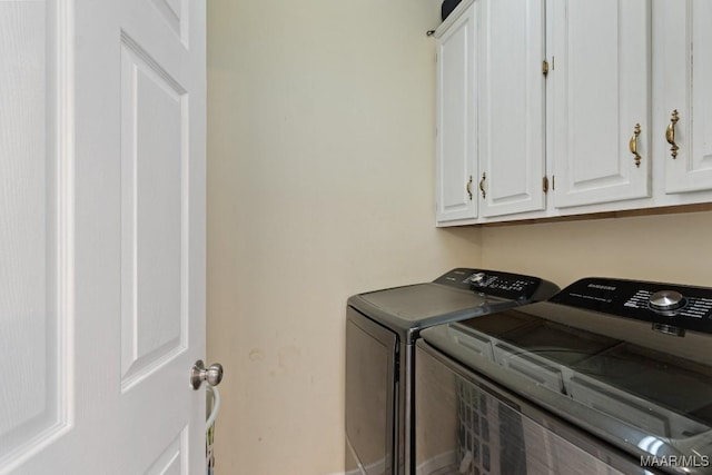 8800 Oak Meadow Ct, Montgomery, AL 36116 - laundry room featuring cabinet space and washer and clothes dryer