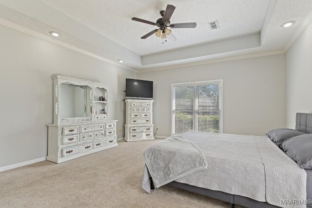 8800 Oak Meadow Ct, Montgomery, AL 36116 - carpeted bedroom featuring a textured ceiling, visible vents, ornamental molding, a tray ceiling, and recessed lighting