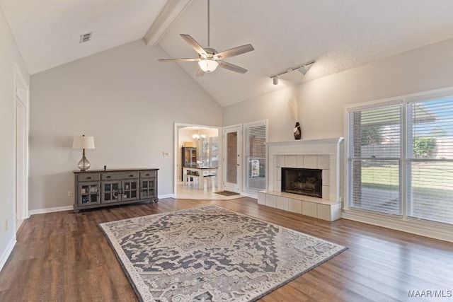 8800 Oak Meadow Ct, Montgomery, AL 36116 - living area featuring visible vents, beam ceiling, wood finished floors, high vaulted ceiling, and ceiling fan with notable chandelier