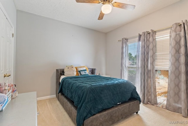 8800 Oak Meadow Ct, Montgomery, AL 36116 - bedroom with light colored carpet, a textured ceiling, baseboards, and ceiling fan