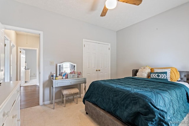 8800 Oak Meadow Ct, Montgomery, AL 36116 - bedroom featuring a closet, attic access, ceiling fan, light colored carpet, and a textured ceiling