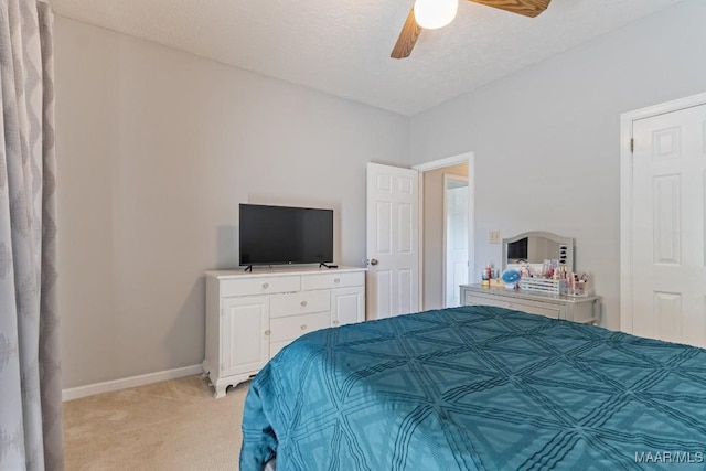 8800 Oak Meadow Ct, Montgomery, AL 36116 - bedroom featuring baseboards, a ceiling fan, a textured ceiling, and light carpet