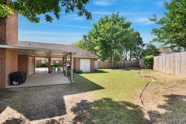 8800 Oak Meadow Ct, Montgomery, AL 36116 - view of yard featuring a patio, ceiling fan, an outbuilding, and a fenced backyard