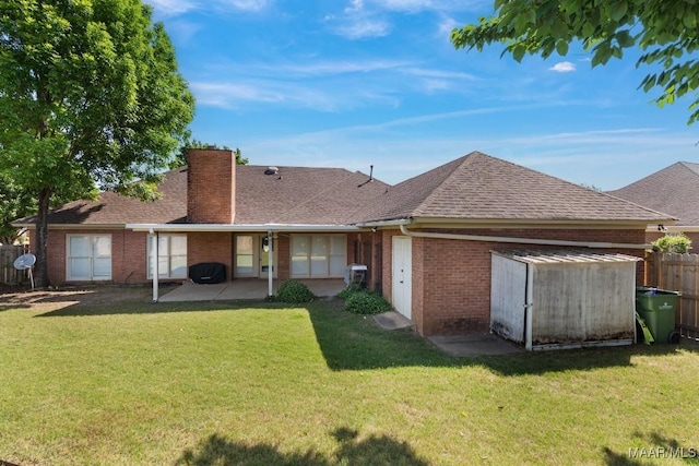 8800 Oak Meadow Ct, Montgomery, AL 36116 - rear view of property with fence, a patio, a chimney, brick siding, and a yard