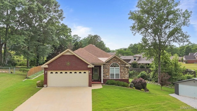 single story home with a garage, a front lawn, fence, and driveway