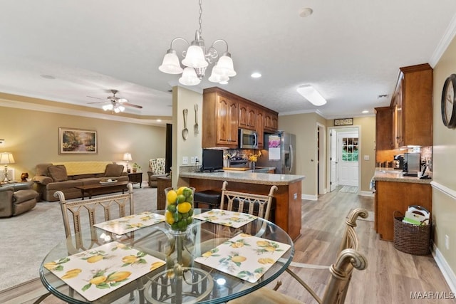 dining room with crown molding, baseboards, recessed lighting, light wood finished floors, and ceiling fan with notable chandelier