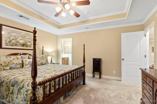bedroom with a raised ceiling, ornamental molding, carpet, and visible vents