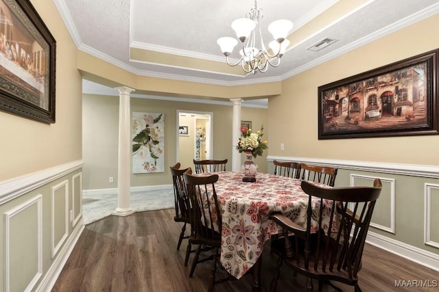 dining area with decorative columns, dark wood-style flooring, and visible vents