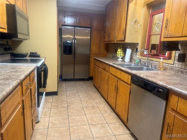 3037 Willow Lane Dr, Montgomery, AL 36109 - kitchen featuring a sink, appliances with stainless steel finishes, light tile patterned floors, and tasteful backsplash