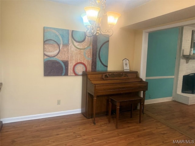 3037 Willow Lane Dr, Montgomery, AL 36109 - living area with an inviting chandelier, baseboards, and wood finished floors
