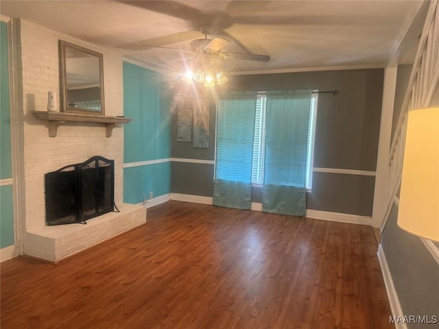 3037 Willow Lane Dr, Montgomery, AL 36109 - unfurnished living room with crown molding, a ceiling fan, a brick fireplace, and wood finished floors