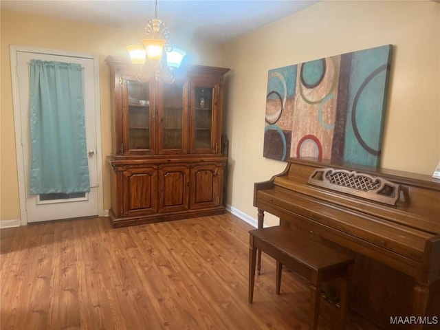 3037 Willow Lane Dr, Montgomery, AL 36109 - living area featuring baseboards, a notable chandelier, and wood finished floors