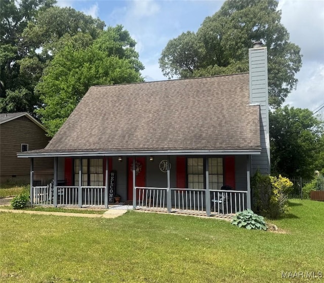 3037 Willow Lane Dr, Montgomery, AL 36109 - view of front of house with covered porch, a shingled roof, a chimney, and a front lawn