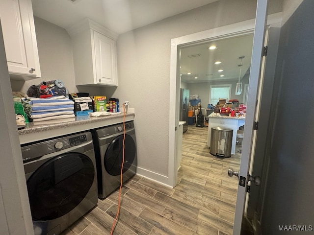 107 Jules Ln, Ashford, AL 36312 - laundry room with separate washer and dryer, cabinet space, light wood-style flooring, baseboards, and recessed lighting