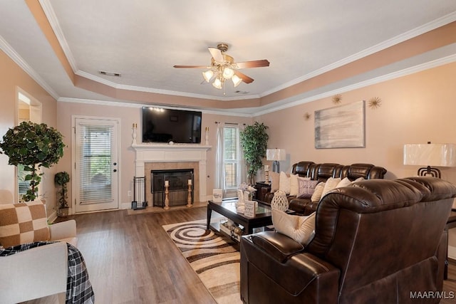 177 Old Orchard Loop, Deatsville, AL 36022 - living area featuring a ceiling fan, healthy amount of natural light, wood finished floors, a fireplace, and ornamental molding