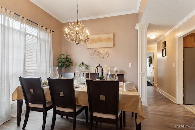 177 Old Orchard Loop, Deatsville, AL 36022 - dining area featuring healthy amount of natural light, crown molding, a chandelier, wood finished floors, and baseboards