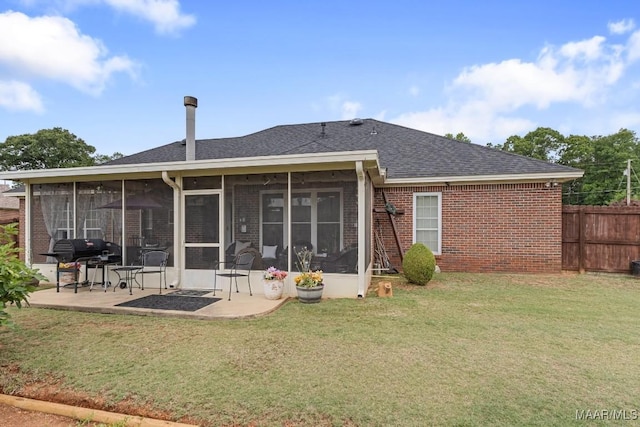 177 Old Orchard Loop, Deatsville, AL 36022 - rear view of house with a patio area, a sunroom, brick siding, and roof with shingles