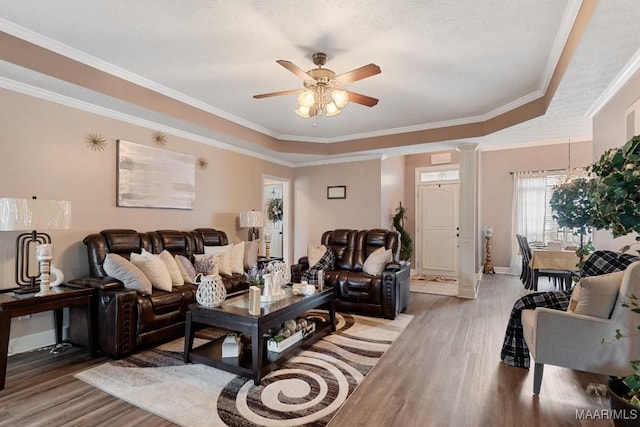 177 Old Orchard Loop, Deatsville, AL 36022 - living area with light wood finished floors, ceiling fan, crown molding, baseboards, and a tray ceiling