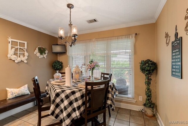 177 Old Orchard Loop, Deatsville, AL 36022 - dining space with tile patterned floors, a chandelier, crown molding, and baseboards