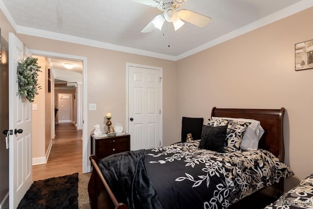 177 Old Orchard Loop, Deatsville, AL 36022 - bedroom featuring crown molding, wood finished floors, baseboards, and ceiling fan