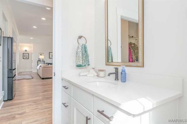 8307 Young Xing, Montgomery, AL 36116 - bathroom with vanity, recessed lighting, and wood finished floors