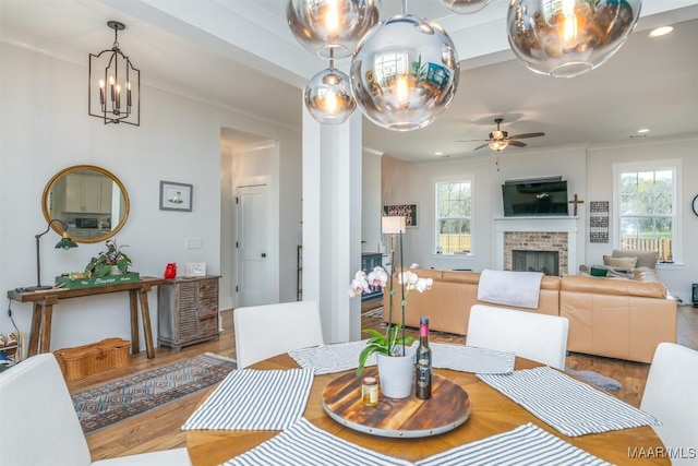 8307 Young Xing, Montgomery, AL 36116 - dining room featuring plenty of natural light, wood finished floors, and a fireplace