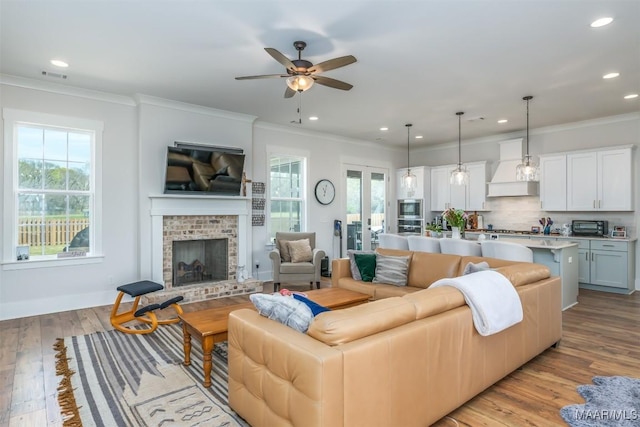 8307 Young Xing, Montgomery, AL 36116 - living area featuring plenty of natural light, recessed lighting, a ceiling fan, and ornamental molding