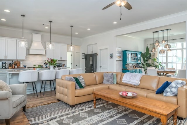 8307 Young Xing, Montgomery, AL 36116 - living area featuring crown molding, recessed lighting, and wood finished floors