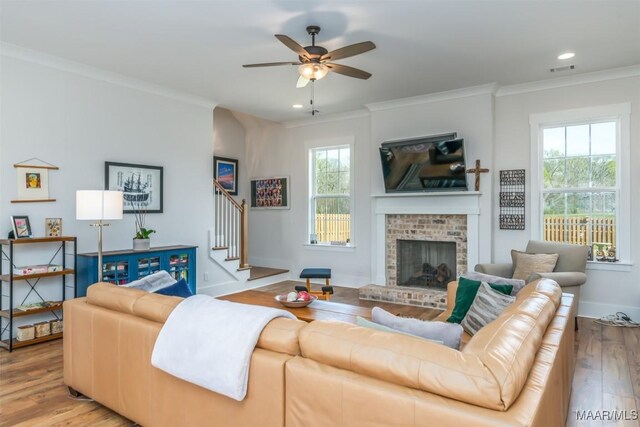 8307 Young Xing, Montgomery, AL 36116 - living area with crown molding, ceiling fan, stairs, and wood finished floors
