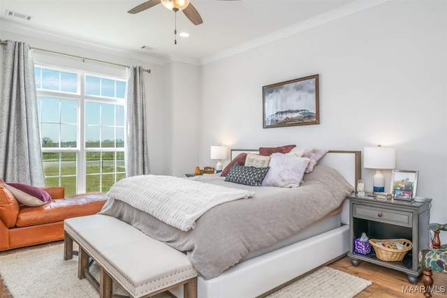 8307 Young Xing, Montgomery, AL 36116 - bedroom with visible vents, ornamental molding, light wood-style flooring, and ceiling fan
