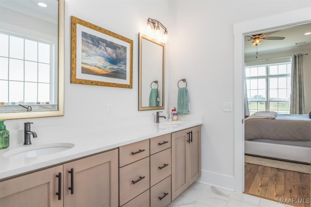 8307 Young Xing, Montgomery, AL 36116 - ensuite bathroom featuring double vanity, a sink, baseboards, and a ceiling fan