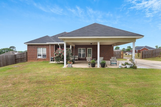 back of house with brick siding, a fenced backyard, and roof with shingles