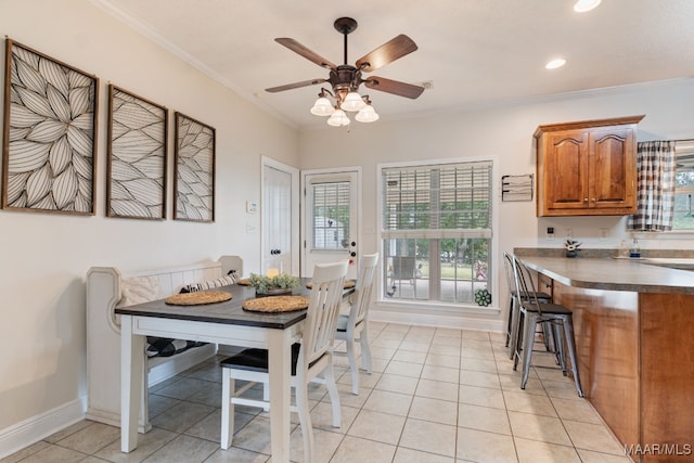 dining space featuring ornamental molding, baseboards, ceiling fan, recessed lighting, and light tile patterned floors