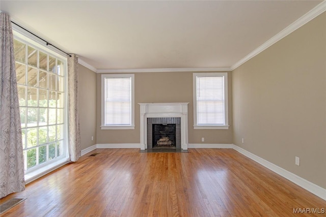1943 Gorgas St, Montgomery, AL 36106 - unfurnished living room featuring crown molding, a fireplace, wood finished floors, and visible vents