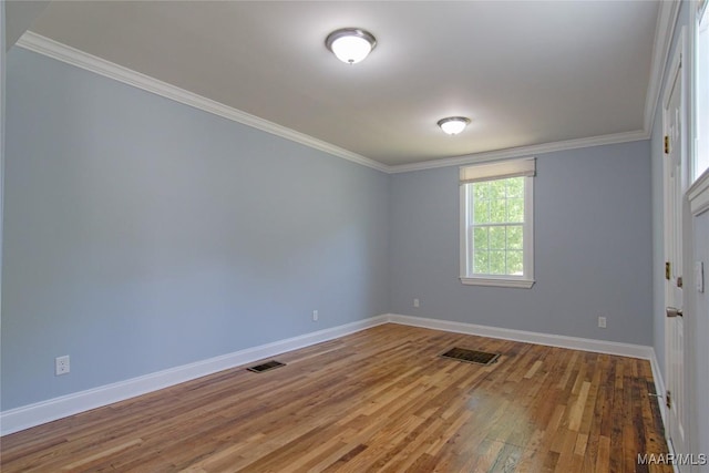 1943 Gorgas St, Montgomery, AL 36106 - empty room featuring crown molding, baseboards, visible vents, and wood finished floors
