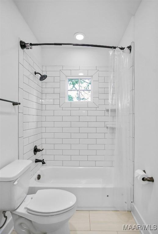 4831 Clerkenwell St, Montgomery, AL 36116 - full bathroom with toilet, tile patterned flooring, and shower / tub combo with curtain