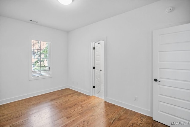 4831 Clerkenwell St, Montgomery, AL 36116 - spare room featuring baseboards, visible vents, and wood finished floors