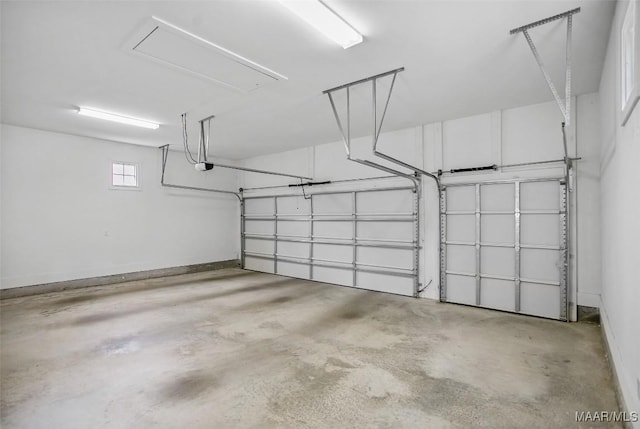 4831 Clerkenwell St, Montgomery, AL 36116 - garage with baseboards and a garage door opener