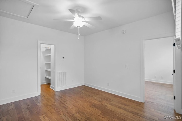 4831 Clerkenwell St, Montgomery, AL 36116 - spare room featuring visible vents, wood finished floors, baseboards, attic access, and a ceiling fan