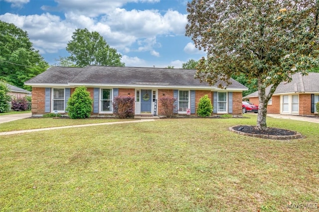 ranch-style house with brick siding and a front yard