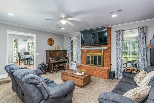 carpeted living area featuring a brick fireplace, a ceiling fan, visible vents, and recessed lighting