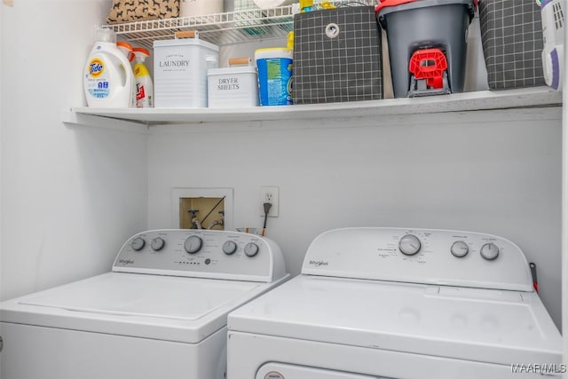 laundry room featuring washing machine and dryer