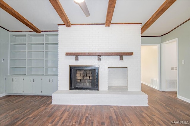 unfurnished living room featuring beam ceiling, wood finished floors, visible vents, and a fireplace