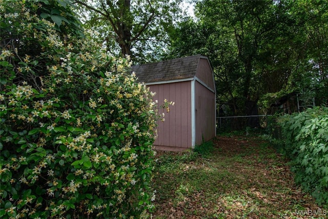 view of shed with fence